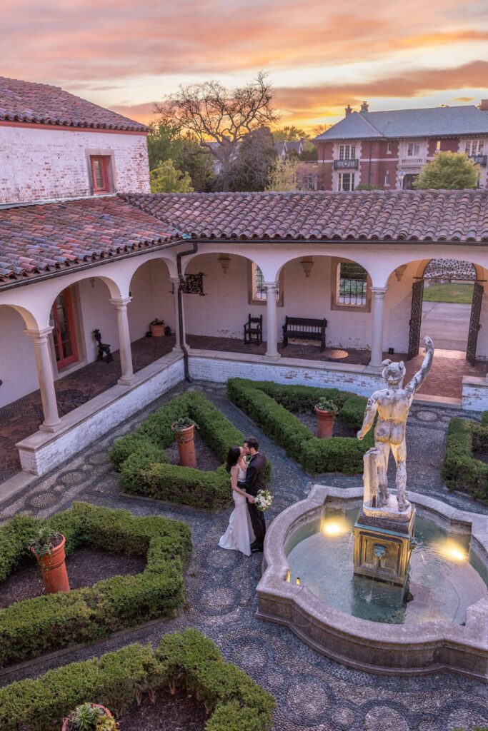 Sunset over Villa Terrace Courtyard with Wedding Couple