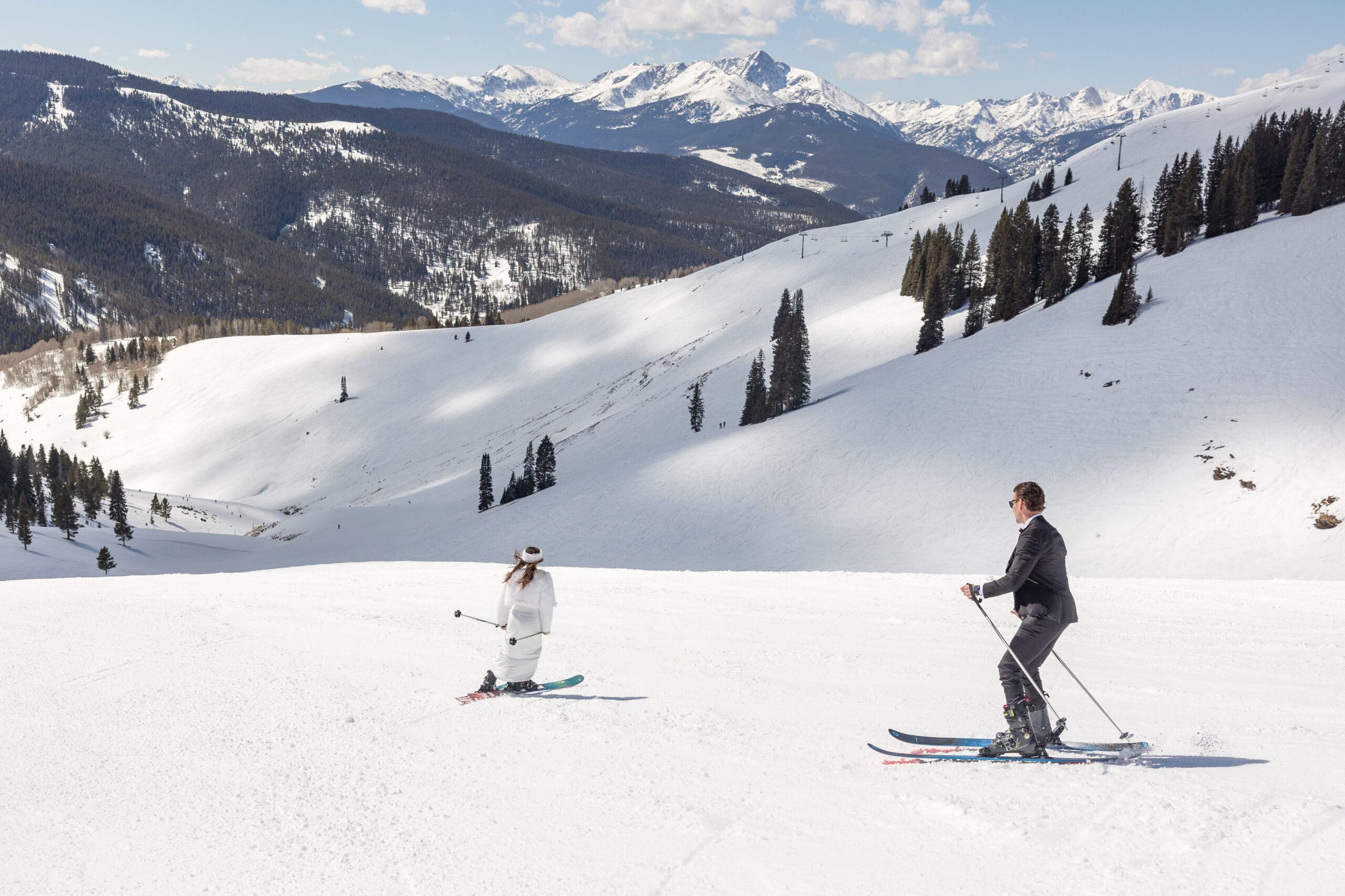 Wedding couple skiing at vail